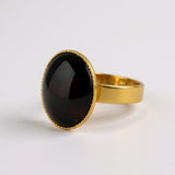 ANELLO OVALE CON GRANATO