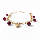 BRACCIALE CON PIETRE ROSSE E CIONDOLO A CUORE DORATO