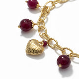 BRACCIALE CON PIETRE ROSSE E CIONDOLO A CUORE DORATO